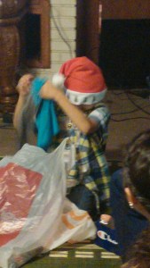 my baby brother opening his presents . . . SURPRISE YOU GET CLOTHES!!!
